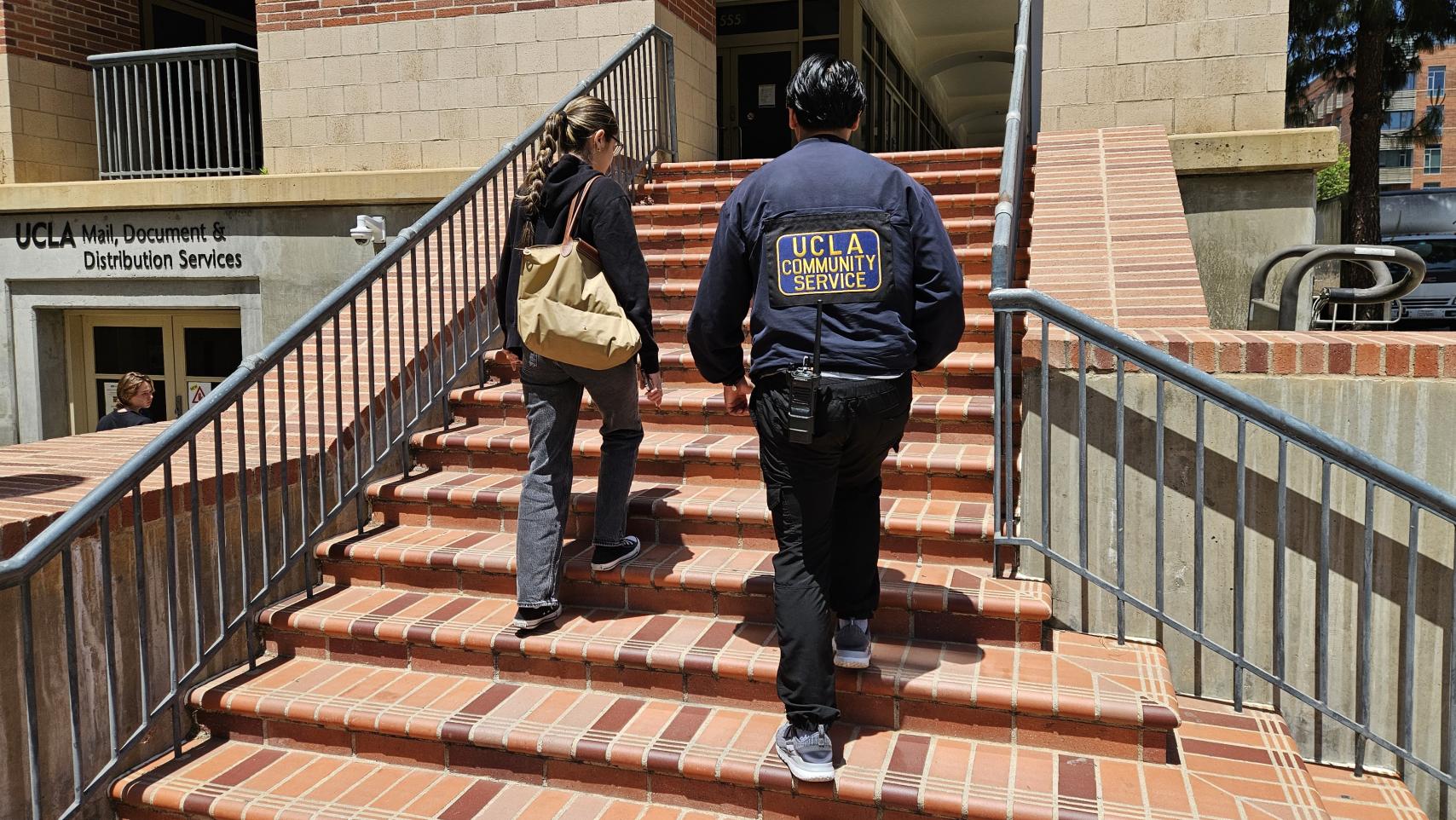 CSO officer walking with student