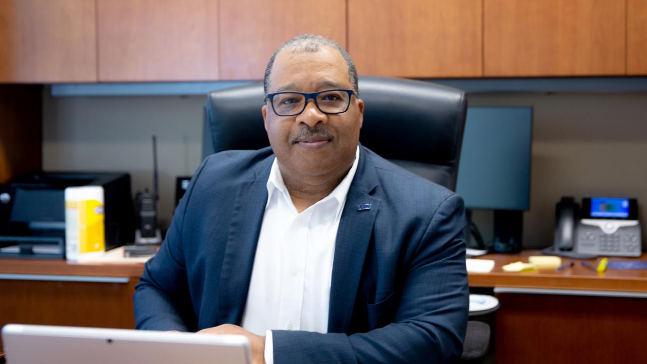 Interim Chief John Thomas sitting at his desk