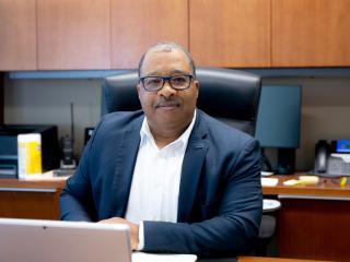 Interim Chief John Thomas sitting at his desk